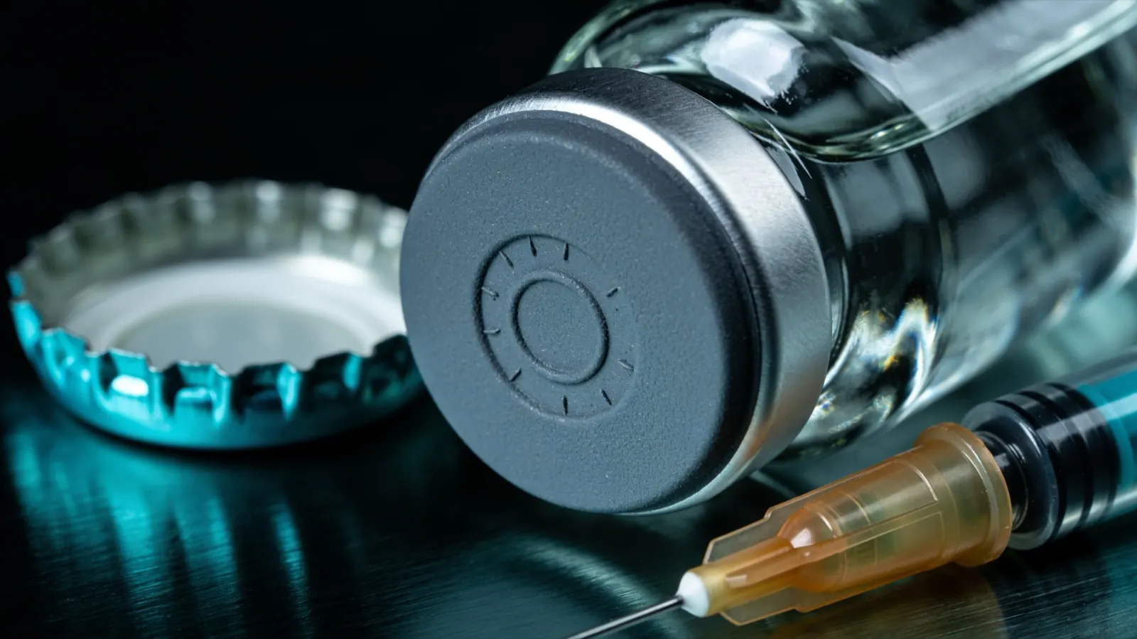 Close-up of a vial closure and a needle, the entry point on a vial of bacteriostatic water for peptides